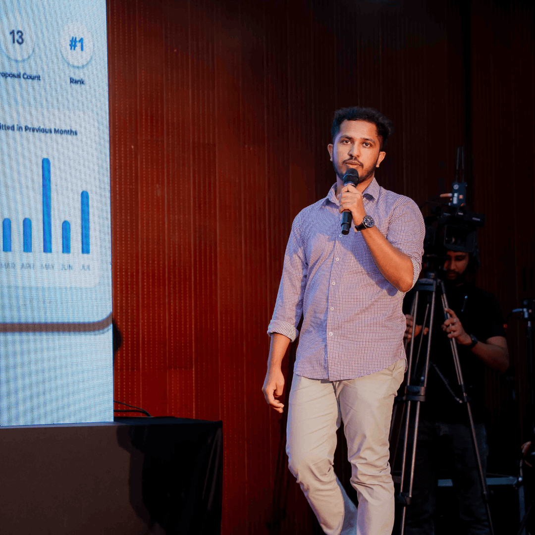 Harshana Amuwatte presenting a mobile app at a tech event